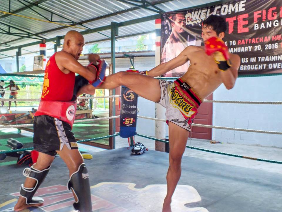 One of the fighters doing pad work. 
